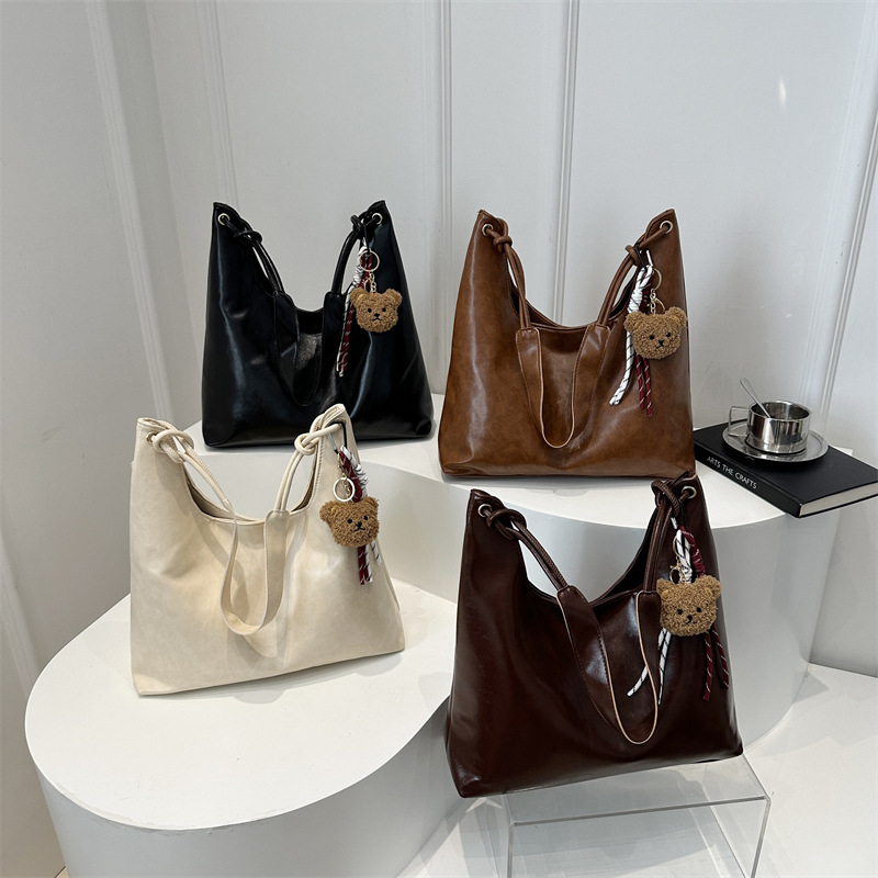 Bolso de brazo retro para mujeres 2025 primavera nueva moda hollow coreana bolso especial de gran capacidad empalmado bolso de hombro