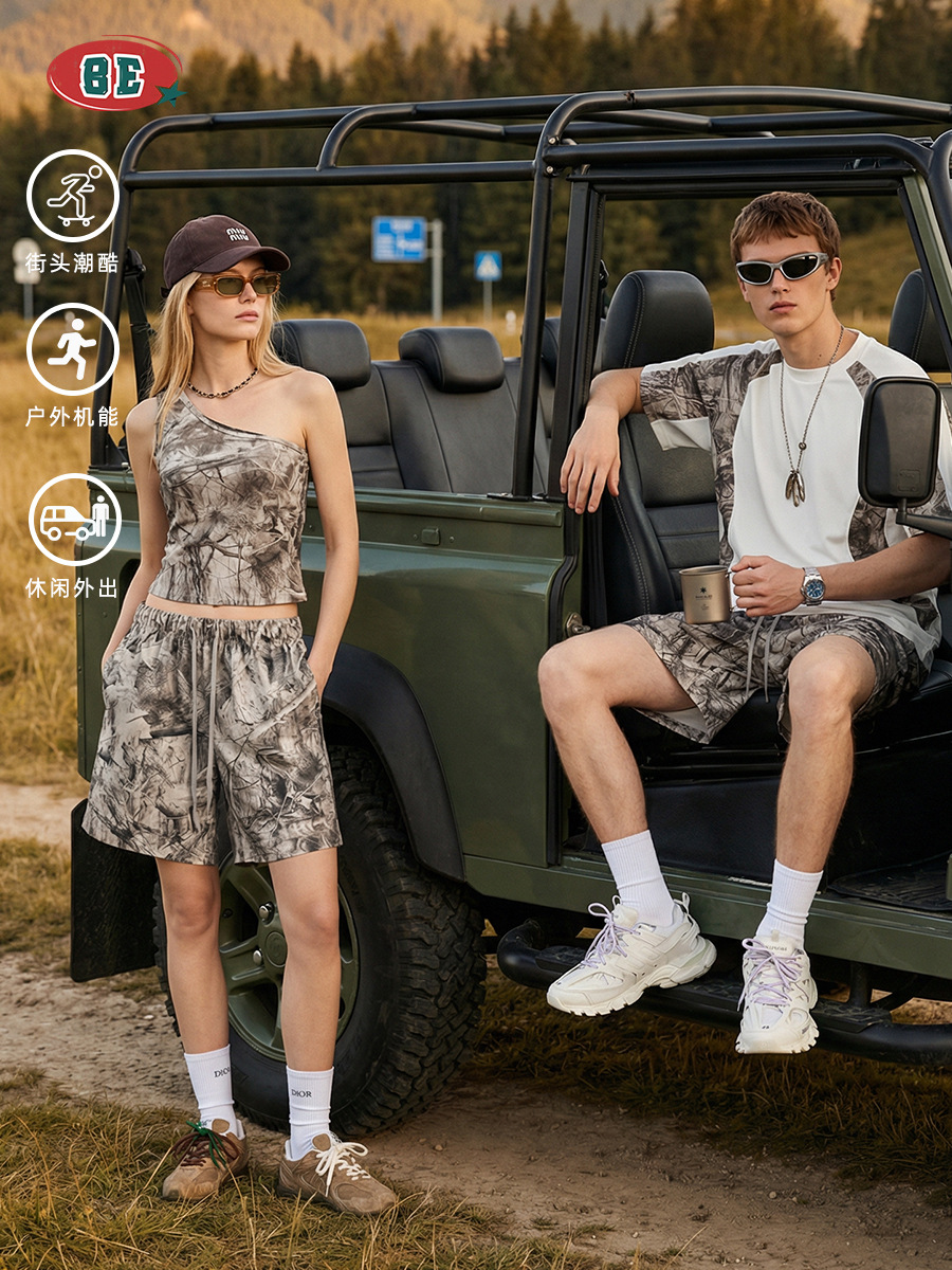 El kit| Verano americano camuflaje de transferencia térmica pareja chaleco camiseta de mangas cortas hombros inclinados pantalones cortos set hombre y mujer