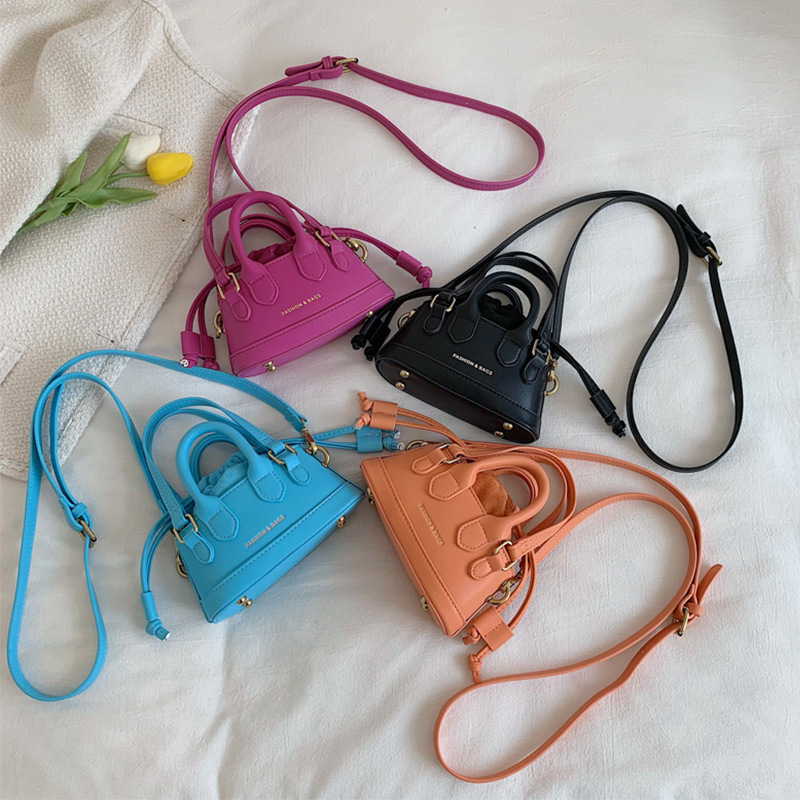 2022 Otoño e Invierno Nueva textura de los niños bolso de mano de moda europea y americana mini bolso de la cáscara transfronteriza bolsa de las mujeres