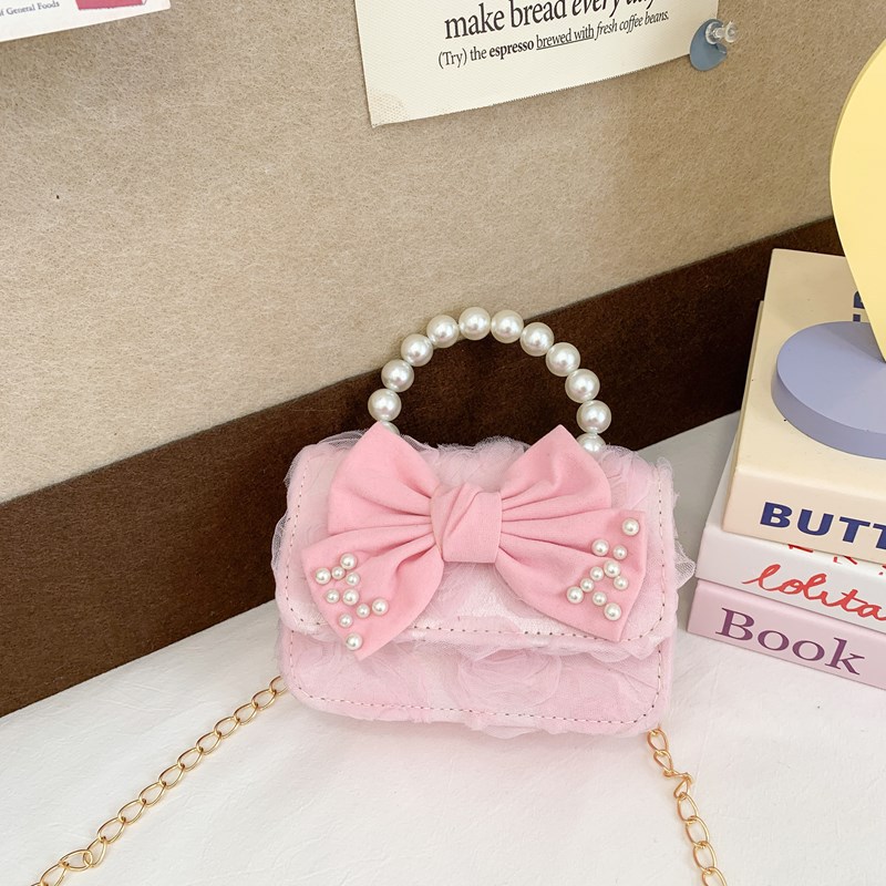 Dulce princesa bolso de hombro de perlas de aire extranjero bolso de mano para niños 2025 mini bolso de arco para niños