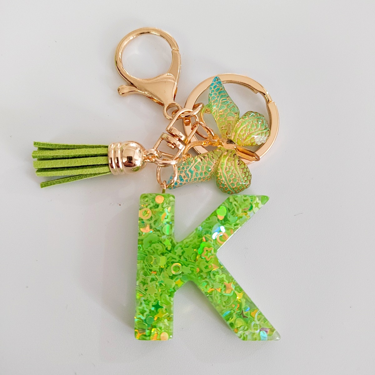 26 letras inglesas llavero colgante estrella verde brillo gota resina colgante llavero de personalidad europea y americana