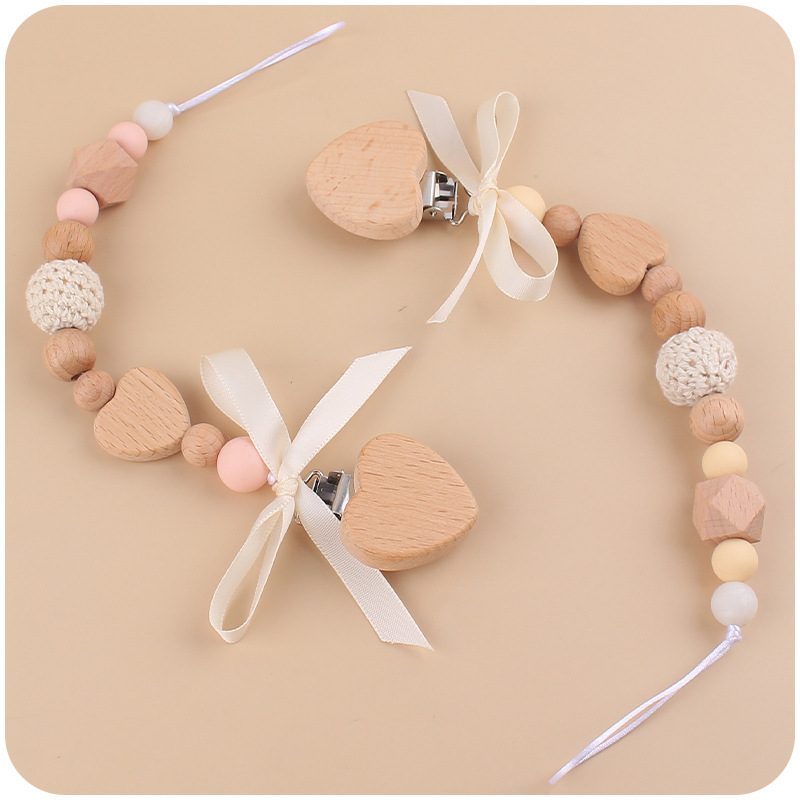 Nuevo bebé de dibujos animados hechos a mano arco chupete cadena creativa DIY bebé silicona teether pulsera juguete