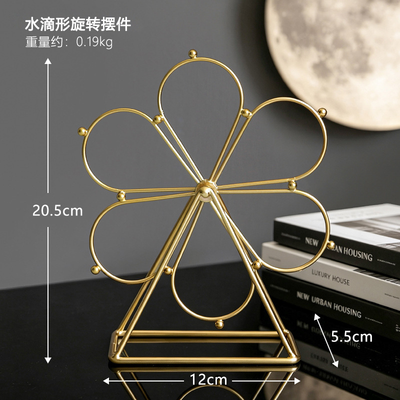 Golden teardrop-shaped ferris wheel rotating ornament