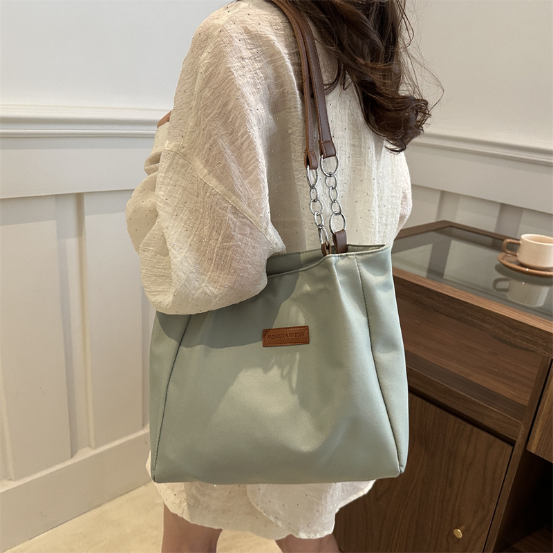 Casual bolsa de viaje de gran capacidad para mujeres 2024 nueva moda bolsa de lona universal bolso de hombro universal bolso simple