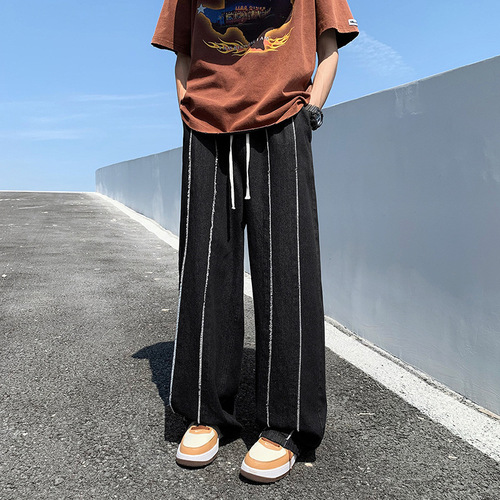 Yellowish-brown wool denim jeans for men, featuring a high-street vibe and an American-style trendy brand design—summer edition, effortlessly cool, with a relaxed, loose fit and straight, wide-leg silhouette.