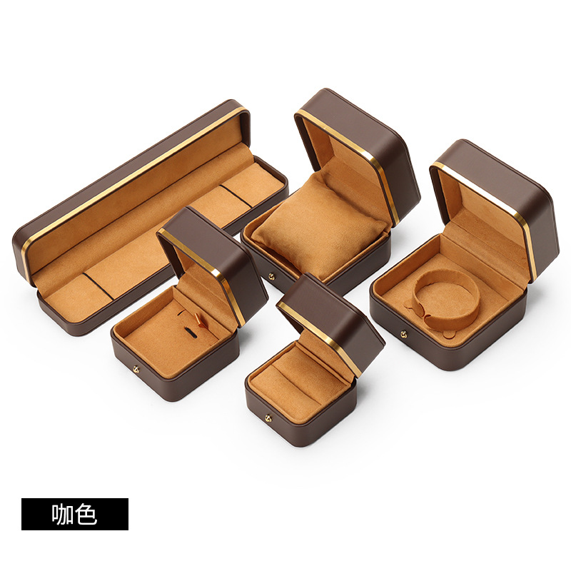 Caja de joyería de cuero de PU de borde dorado redondeado al por mayor caja de regalo de joyería de gama alta caja de reloj caja de joyería colgante de anillo