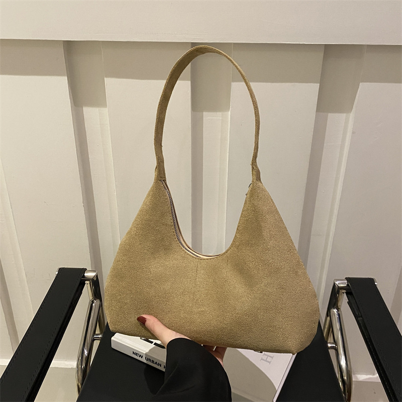 Bolsa de mano de textura retro coreana para mujeres 2025 primavera nuevo estilo de viaje al trabajo molido bolso de hombro axilla
