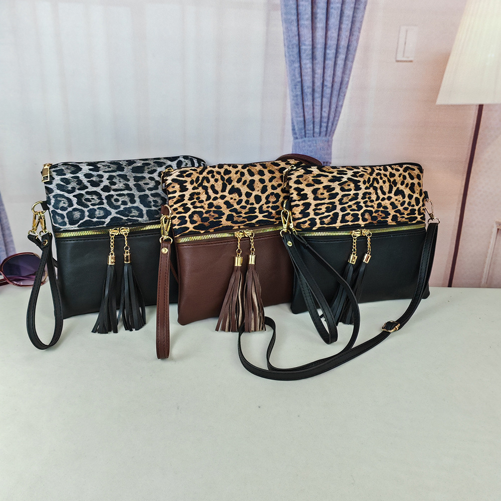 Bolso de leopardo de mujer bolso de moda europeo y americano nuevo bolso inclinado de hombro único bolso de color de choque ultrafino bolso de mano con borlas