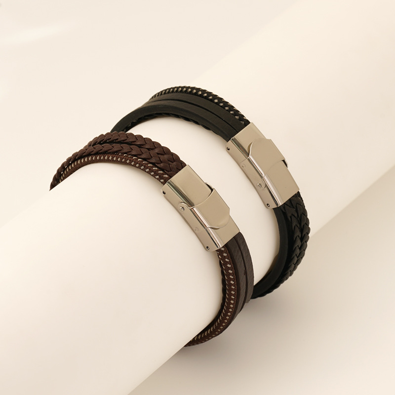 Nueva pulsera tejida con cuerda de cuero al por mayor pulsera de cuero de acero inoxidable para hombres de moda europea y estadounidense pulsera de cuero de varias capas personalizada