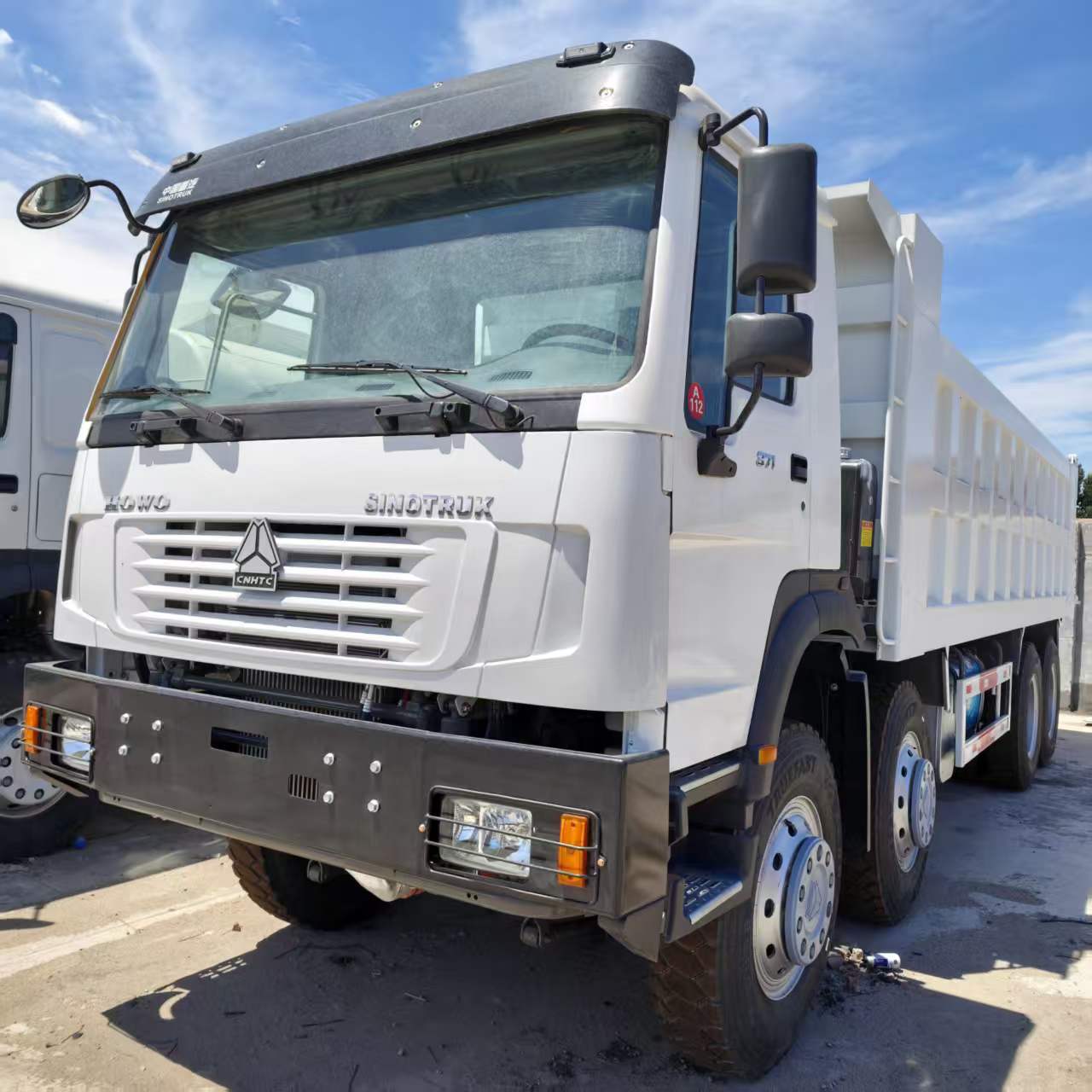 Current Stock for Export: Howo Dump Truck 8X4 Earthmoving Transport Tipper Truck, Heavy-Duty Dump Truck, Earthmoving Truck Parts