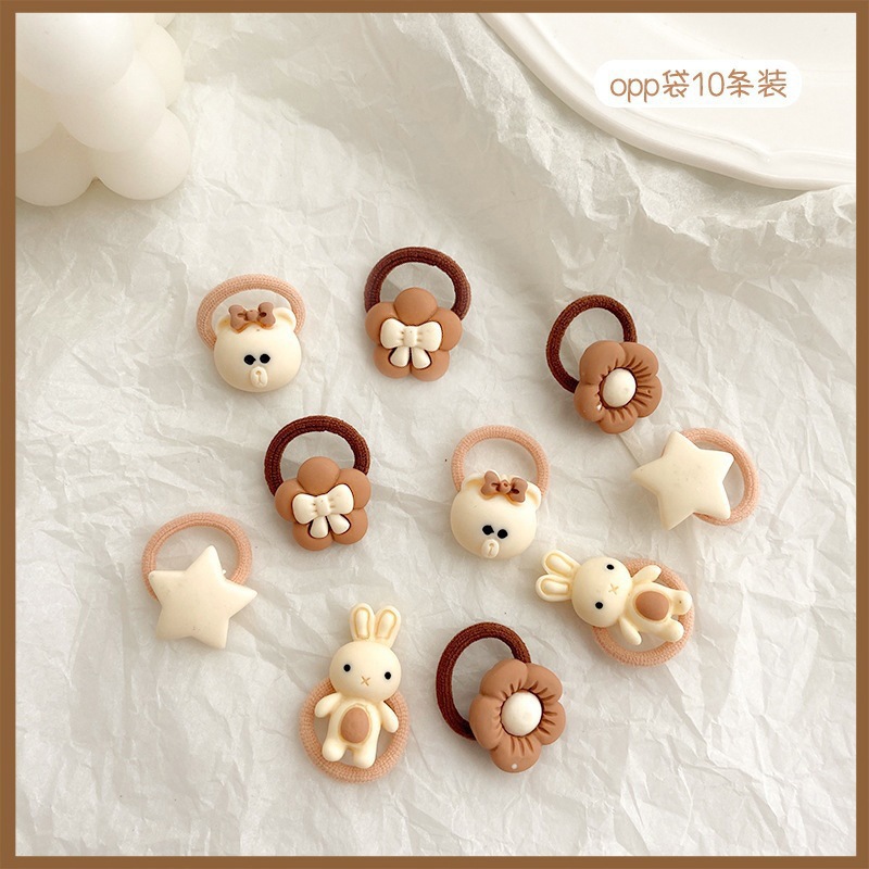 La banda de goma marrón leche simple y Linda para las mujeres no duele la banda del pelo de la cuerda del pelo de la cola de caballo del tamaño pequeño para las mujeres