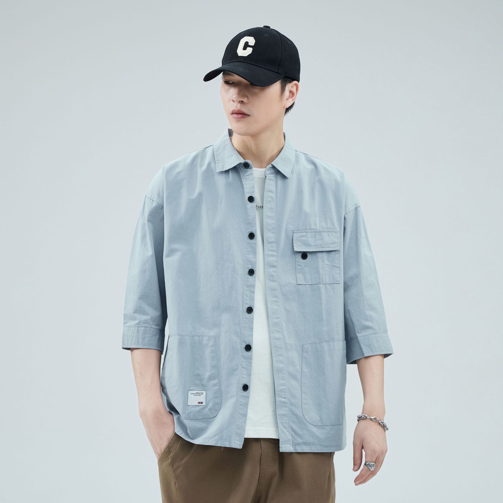 Camisa de trabajo holgada para hombre, primavera y verano, totalmente de algodón, estilo coreano, estilo americano informal, mangas tres cuartos, cuello único, bolsillo, transpirable y que absorbe la humedad.