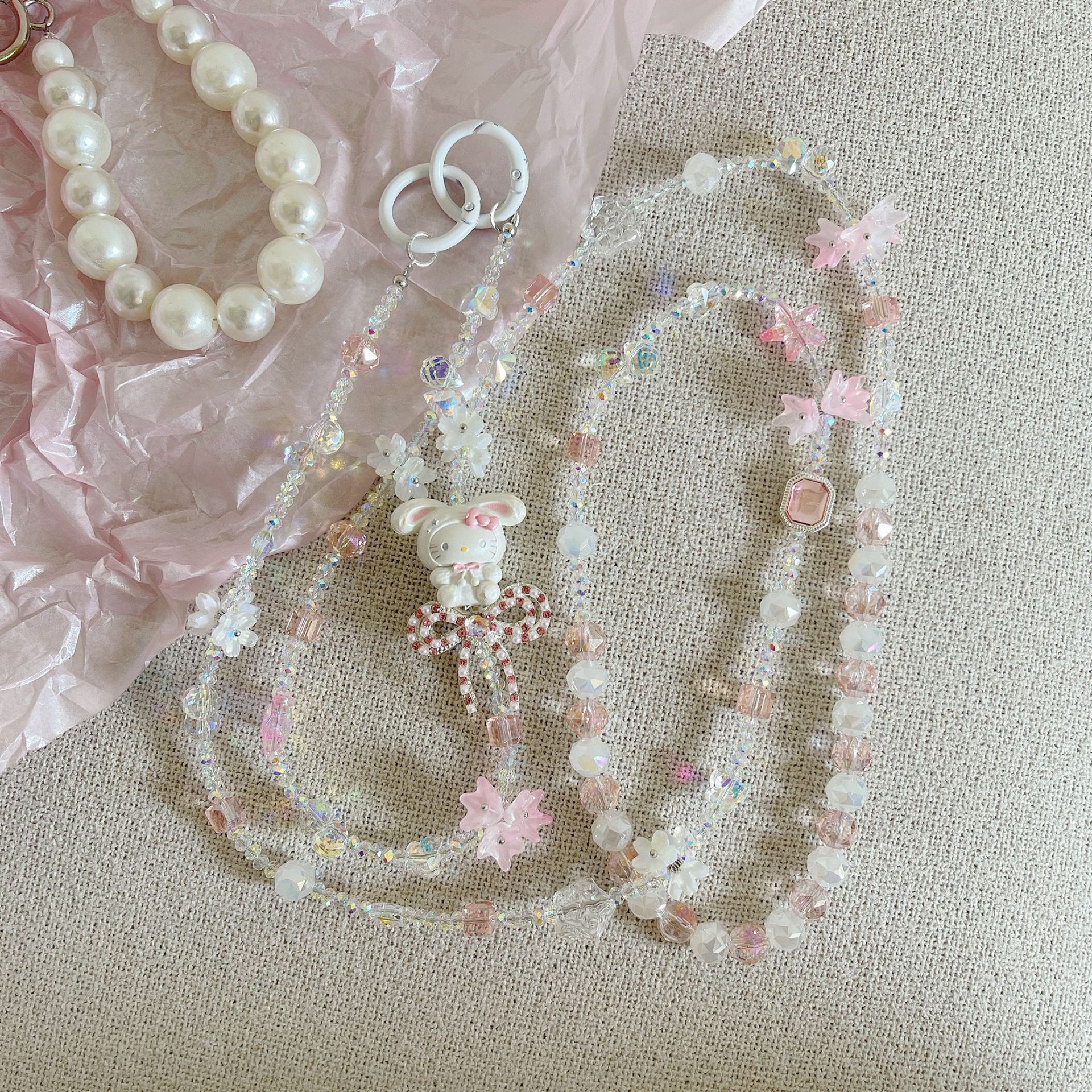 Boutique hecho a mano de alta gama para teléfono móvil cadena larga de gato KT lindo femenino cordón de teléfono móvil de moda colgante de mensajero largo