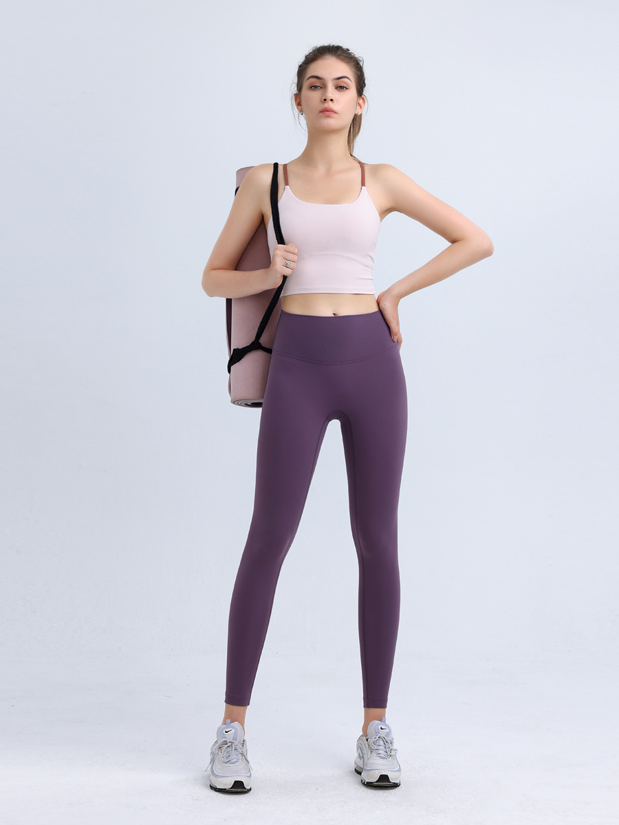 気まずい線の9分のズボンの高弾力のヨガのズボンのレギンスの女性の美のヒップのズボンのやせている腰はやせている運動のタイツを現します