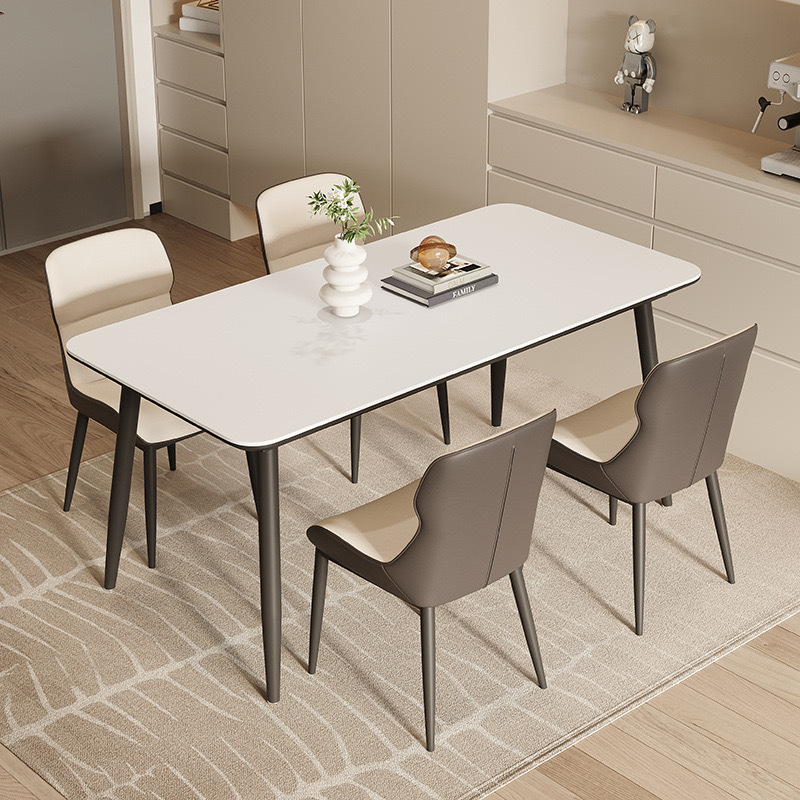 Mesa y silla de comedor de tabla de roca ligera de estilo italiano de lujo, combinación de mesa y silla de comedor de apartamento rectangular moderno y simple.