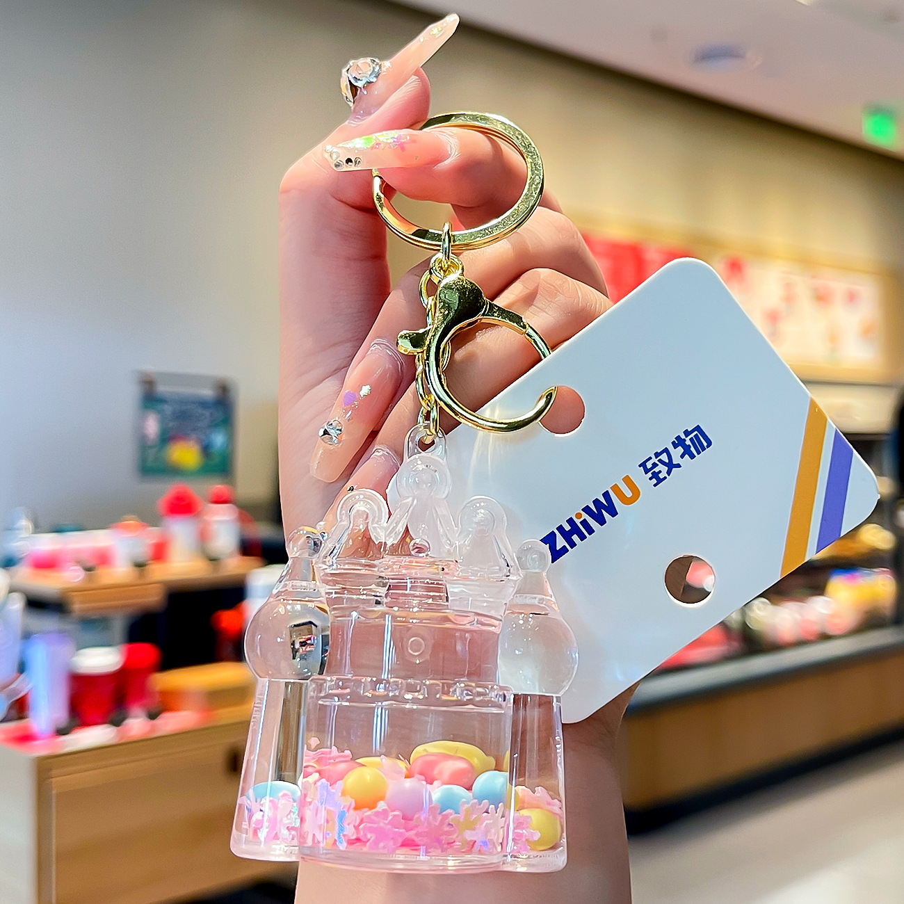 Nuevo aceite de arenas movedizas llavero lindo deriva botella de arenas movedizas colgante coche de dibujos animados llavero pequeño regalo al por mayor