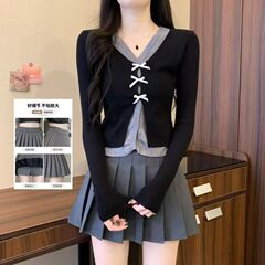 春の新作のニットカーディガンのスカートの女性は腰が高くて痩せています。