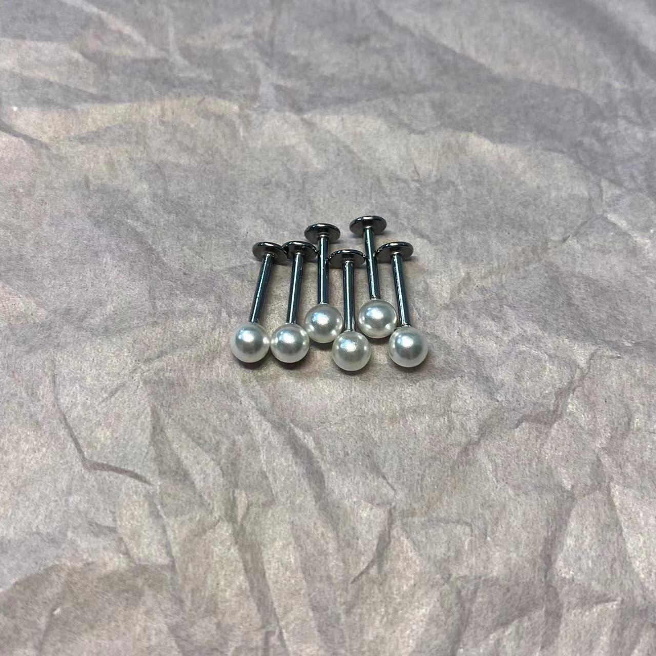 Silver pointed spike labret stud material detail