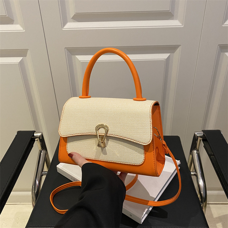 Mendidura de aire occidental patrón de lichi nuevo 2025 bloqueo de verano mensajero casual simple hombro portátil pequeño bolso cuadrado femenino