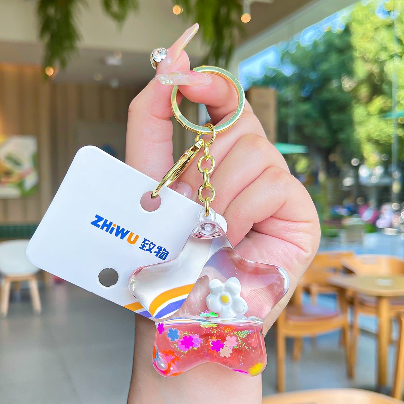 Nuevo aceite de arenas movedizas llavero lindo deriva botella de arenas movedizas colgante coche de dibujos animados llavero pequeño regalo al por mayor