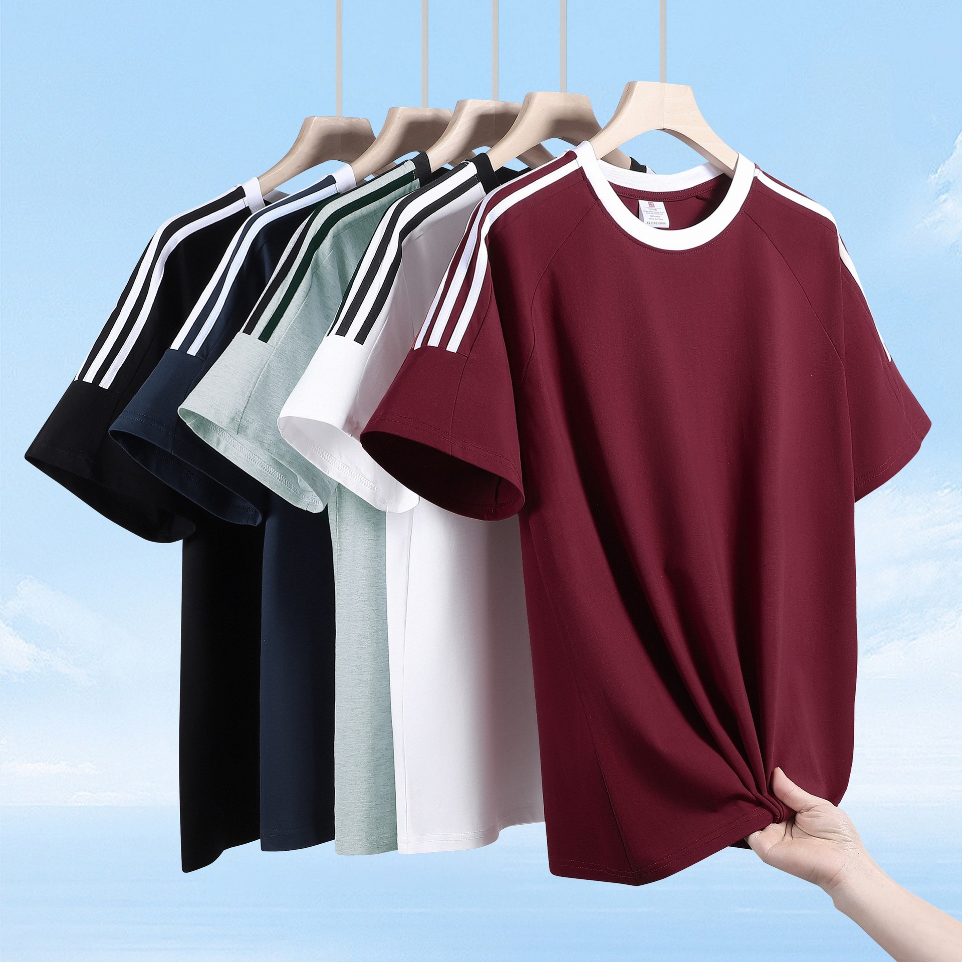 Algodón transfronterizo americano de tres barras de manga corta camiseta deportiva de moda masculina suelta y atractiva chaqueta de comercio exterior