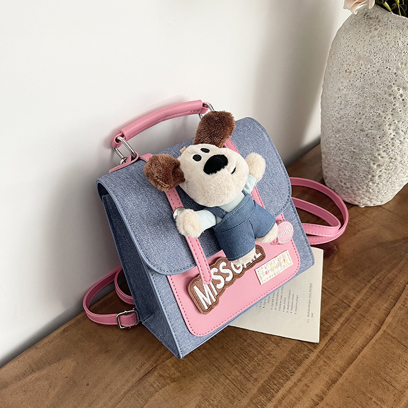 2026 nueva muñeca mochila de dibujos animados mujer textura mochila portátil nicho de viaje diario lindo bolso pequeño