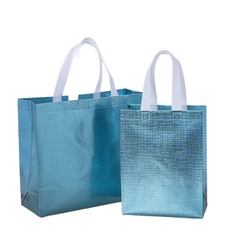 Bolsa de regalo especial de fiesta transfronteriza pequeña película de aluminio en relieve no tejido bolsas láser personalizadas no tejidas