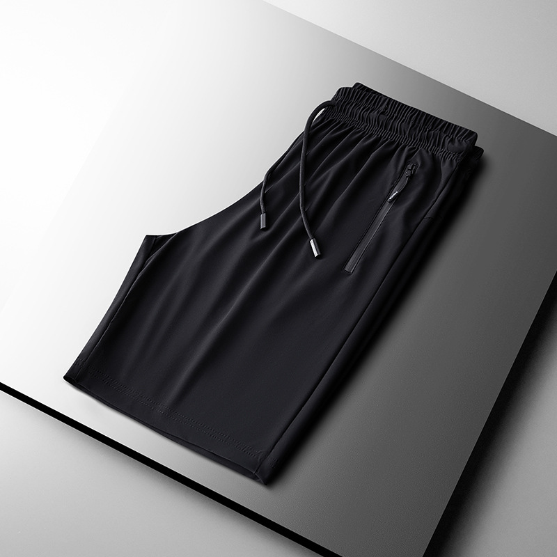 2025 nuevo verano más el tamaño de los pantalones deportivos de nailon pantalones de cinco puntos para hombres pantalones cortos de seda de hielo de color sólido de secado rápido fábrica al por mayor