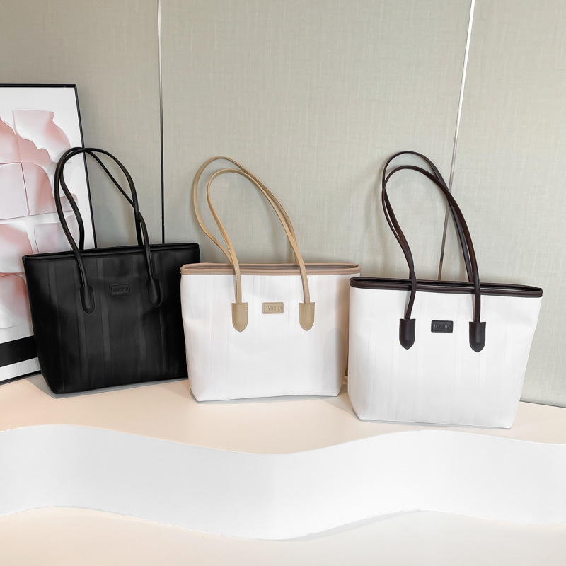 Bolso coreano nicho ZhongTote 2026 nuevo estilo de moda de mujer bolso de hombro de color sólido simple bolso de gran capacidad