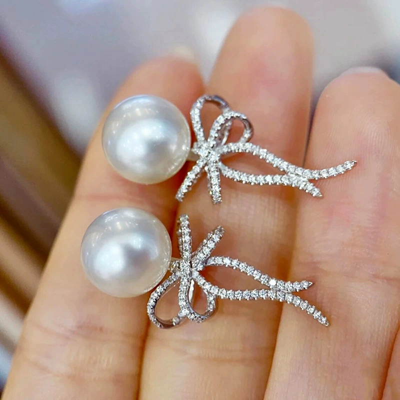 Серьги с бантом и искусственным жемчугом