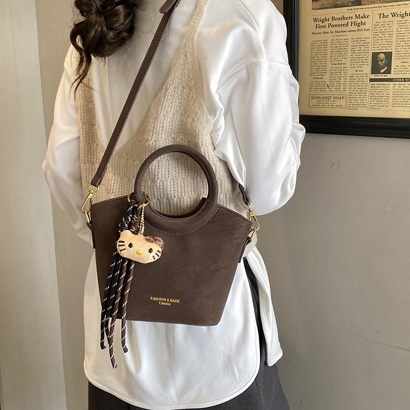 2025 otoño y invierno nuevo bolso retro mochila esmerilado bolso de hombro de moda de mujer bolso de cubo de viaje