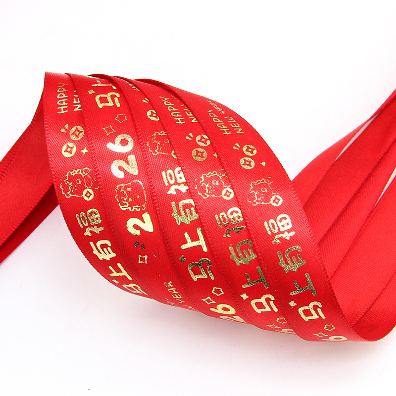 Cinta decorativa Tianyimei de 2 cm con estampado de Año Nuevo 2026, cinta festiva roja de Feliz Año Nuevo, disponible en stock.