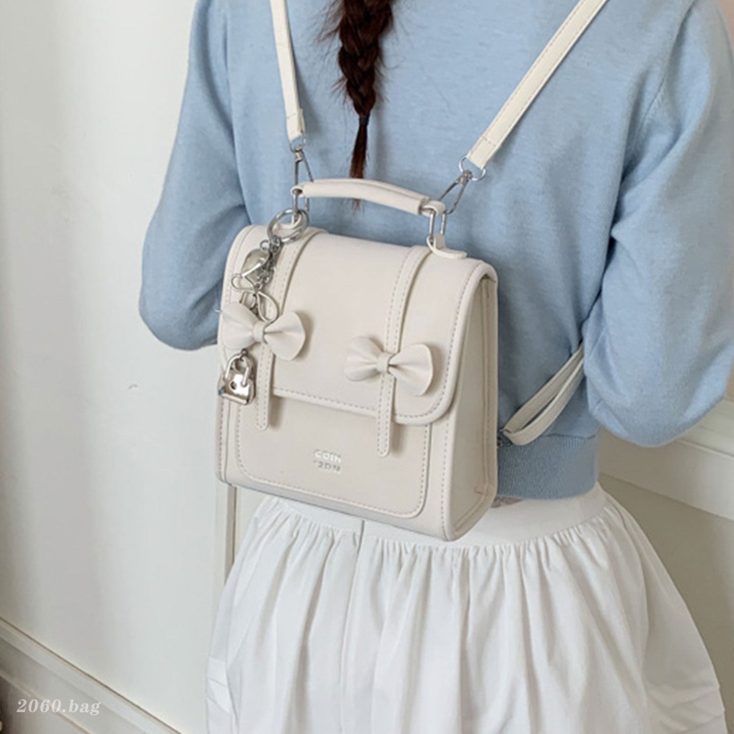 Mochila de temperamento de viaje femenino 2026 de alto valor de cara simple coreana mochila de viaje nuevo arco bolso pequeño
