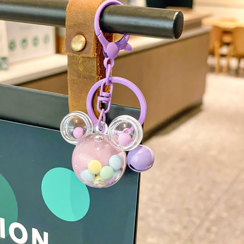 Caricatura en aceite líquido arena flotante botella mochila llavero delicado colgante accesorios accesorios máquina de muñecas pequeños regalos al por mayor