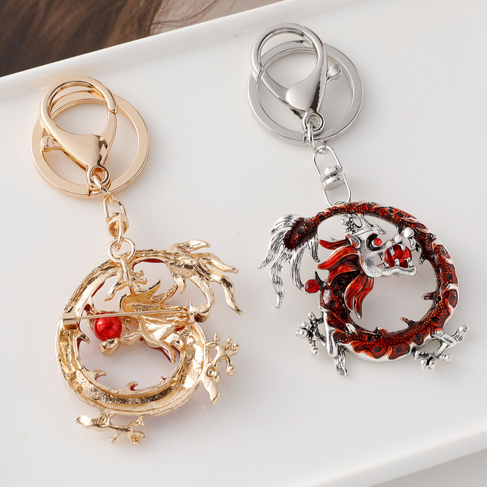 Nuevo retro doce Zodiaco dragón broche llavero de doble uso animal dragón año suerte regalo al por mayor