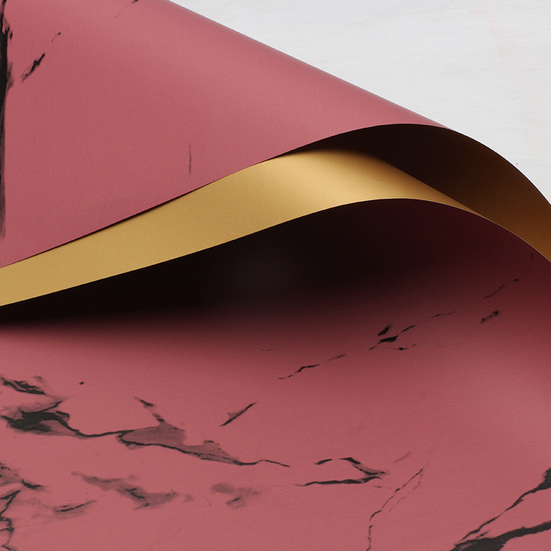 Huaxi comercio exterior transfronterizo mayorista oro lujo papel impermeable mármol oro papel de flor florista papel de embalaje