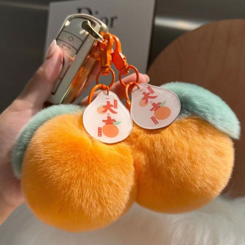 The future of good luck is bright. Small orange car key pendant orange companion gift bag pendant Rex rabbit fur ball gift