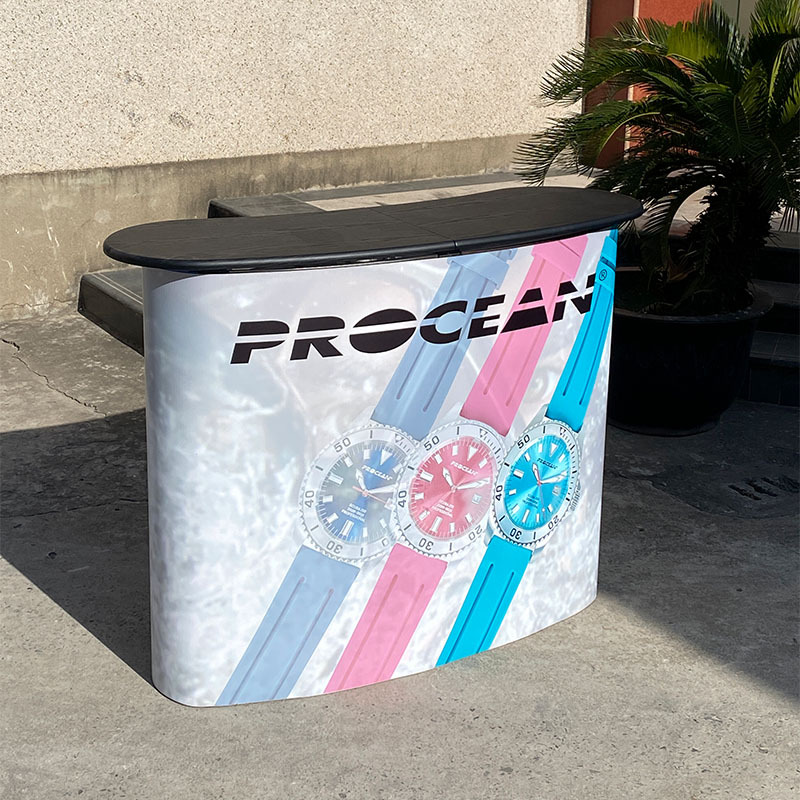 Mesa de promoción de malla de tracción arqueada personalizada exposición centro comercial placa de pintura de absorción recepción de recepción estante de publicidad de lujo stand