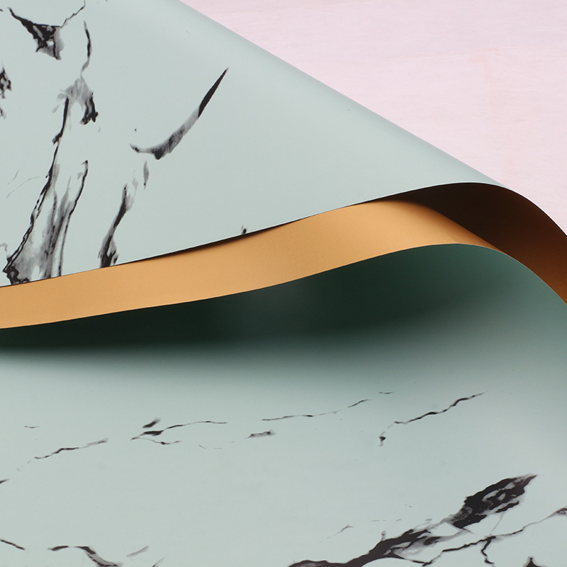 Huaxi comercio exterior transfronterizo mayorista oro lujo papel impermeable mármol oro papel de flor florista papel de embalaje