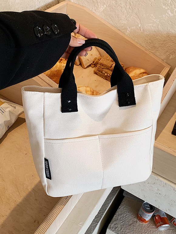 Bolsa de mujer 2026 nuevo bolso de lona de viaje multibolsillo bolso de bolsa de publicidad logotipo impresa en stock
