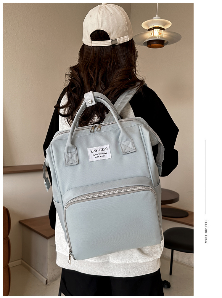 Solid-color lightweight mom bag, a backpack for taking kids out, multi-functional large-capacity mother and baby bag for girls undefined