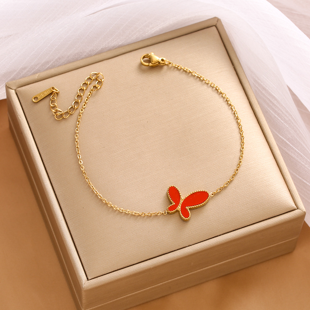 Pulsera de trébol de acero titanium vendedora caliente transfronteriza europea y americana con incrustaciones de concha pulsera colgante pulsera de diseño avanzado sin desvanecimiento al por mayor