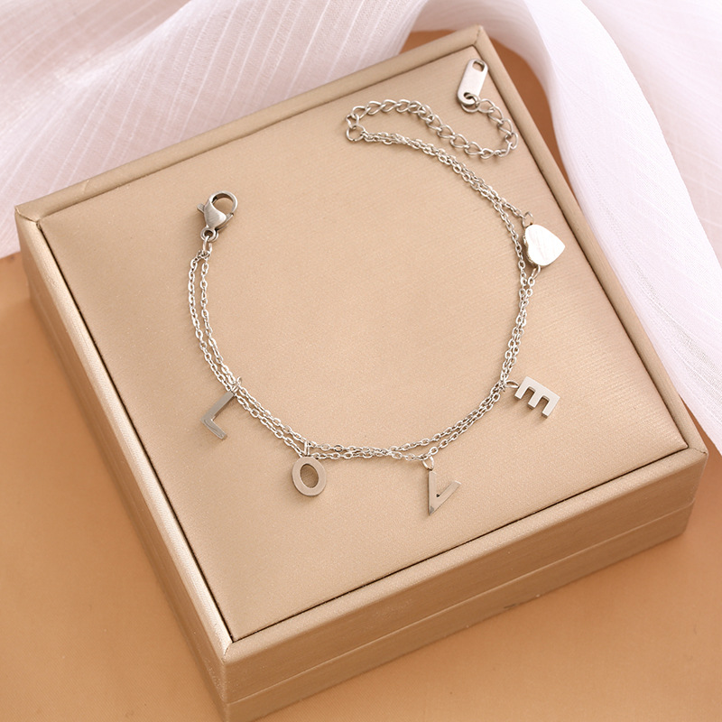 Pulsera de trébol de acero titanium vendedora caliente transfronteriza europea y americana con incrustaciones de concha pulsera colgante pulsera de diseño avanzado sin desvanecimiento al por mayor