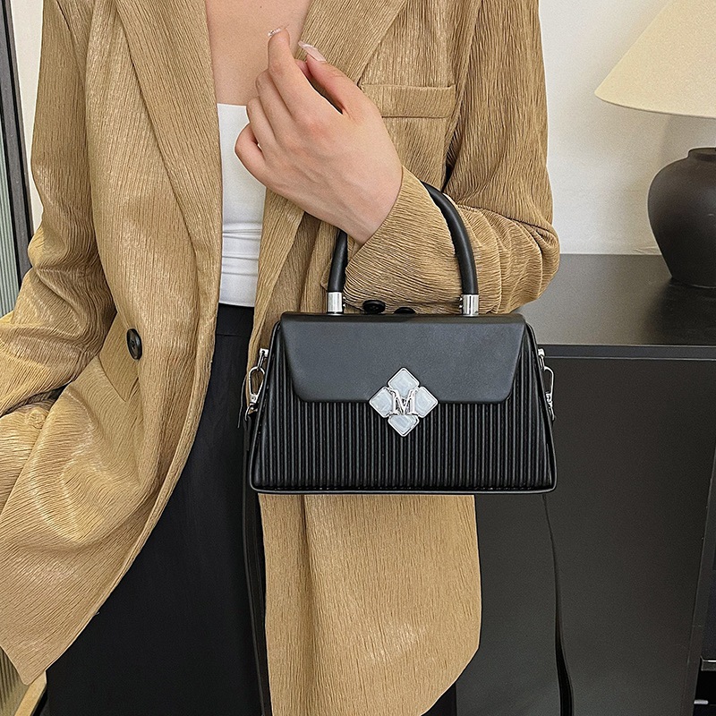 Bolso de textura transfronteriza 2025 verano nuevo bolso femenino moda bolso de hombro a rayas transmisión en vivo del mismo estilo bolso de mensajero marea