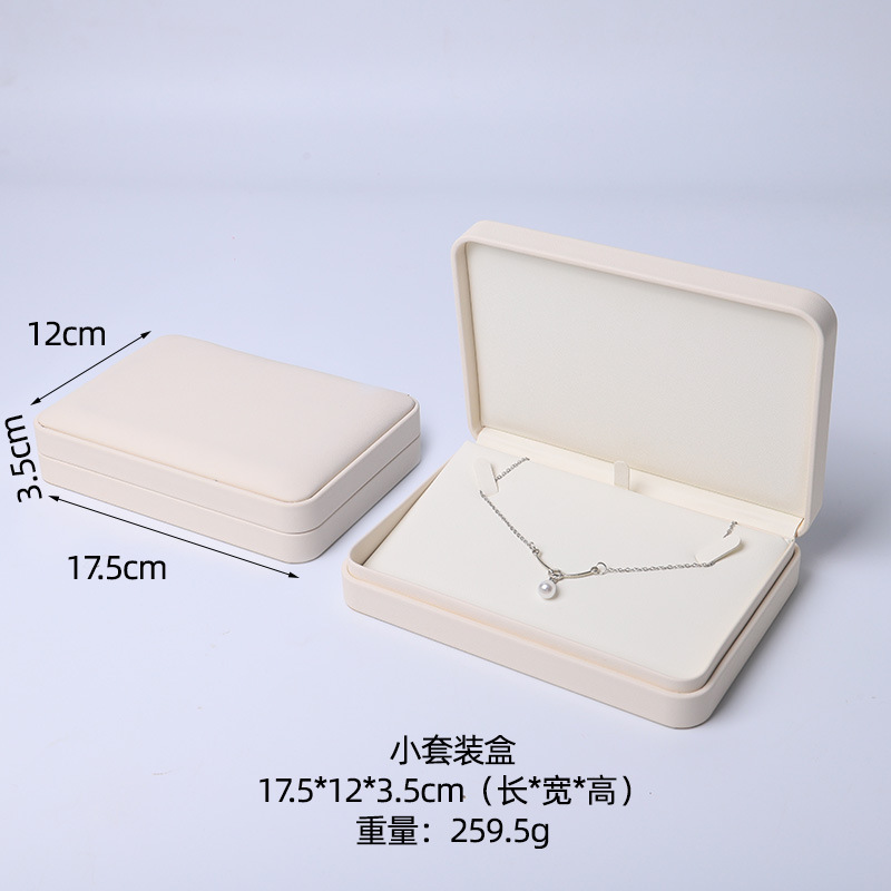 Caja de joyería rosa de alta calidad de cuero pu caja de embalaje de marca de joyería logotipo colgante pulsera collar caja de anillo