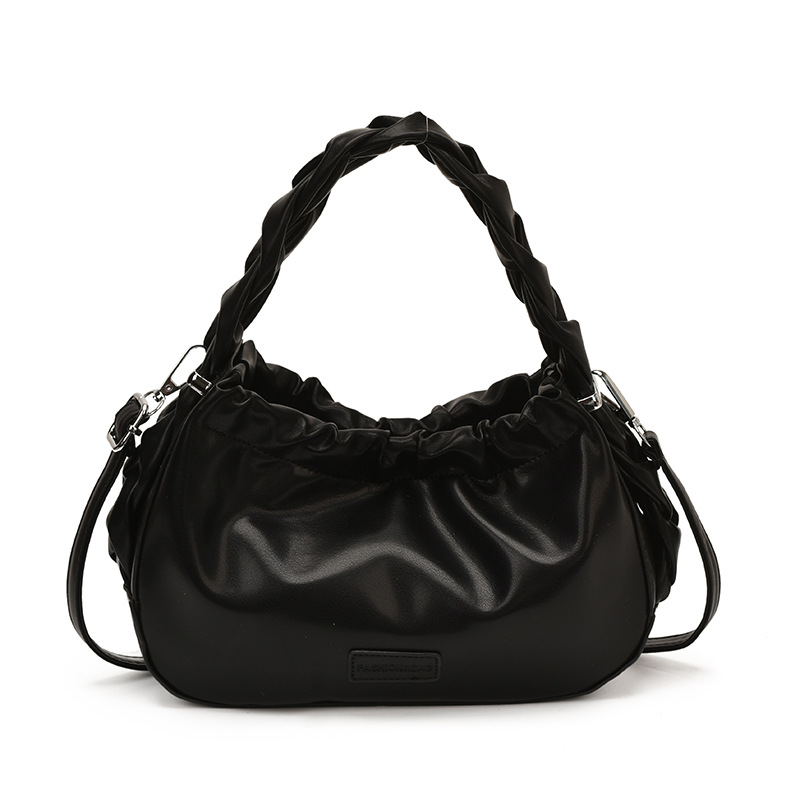 Corea del Sur nueva bolsa de mano plegada mujer 2026 primavera nicho versátil bolso de mochila simple de moda bolsa de nube de viaje