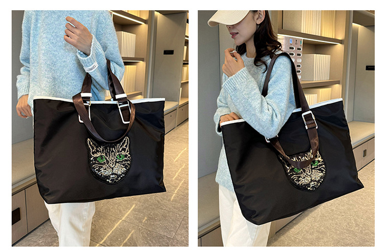 New Portable Travel Shopping Bag For Outgoing Large Capacity Storage Handbag One Shoulder Shining Cat Head Tote Women's Bag_voghion.com