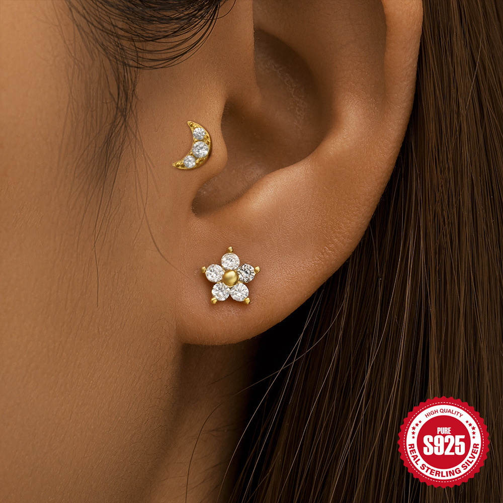 Moda europea y americana todo fósforo s925 plata esterlina tres diamantes borlas de ojo de caballo de doble cara uso de pernos en espiral de cartílago