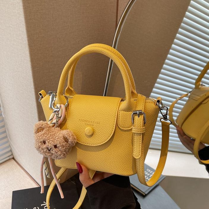 Bolsos pequeños de mano más vendidos de comercio exterior para mujer 2025 nuevo bolso cuadrado pequeño simple y todo fósforo textura casual bolso de mensajero de un solo hombro