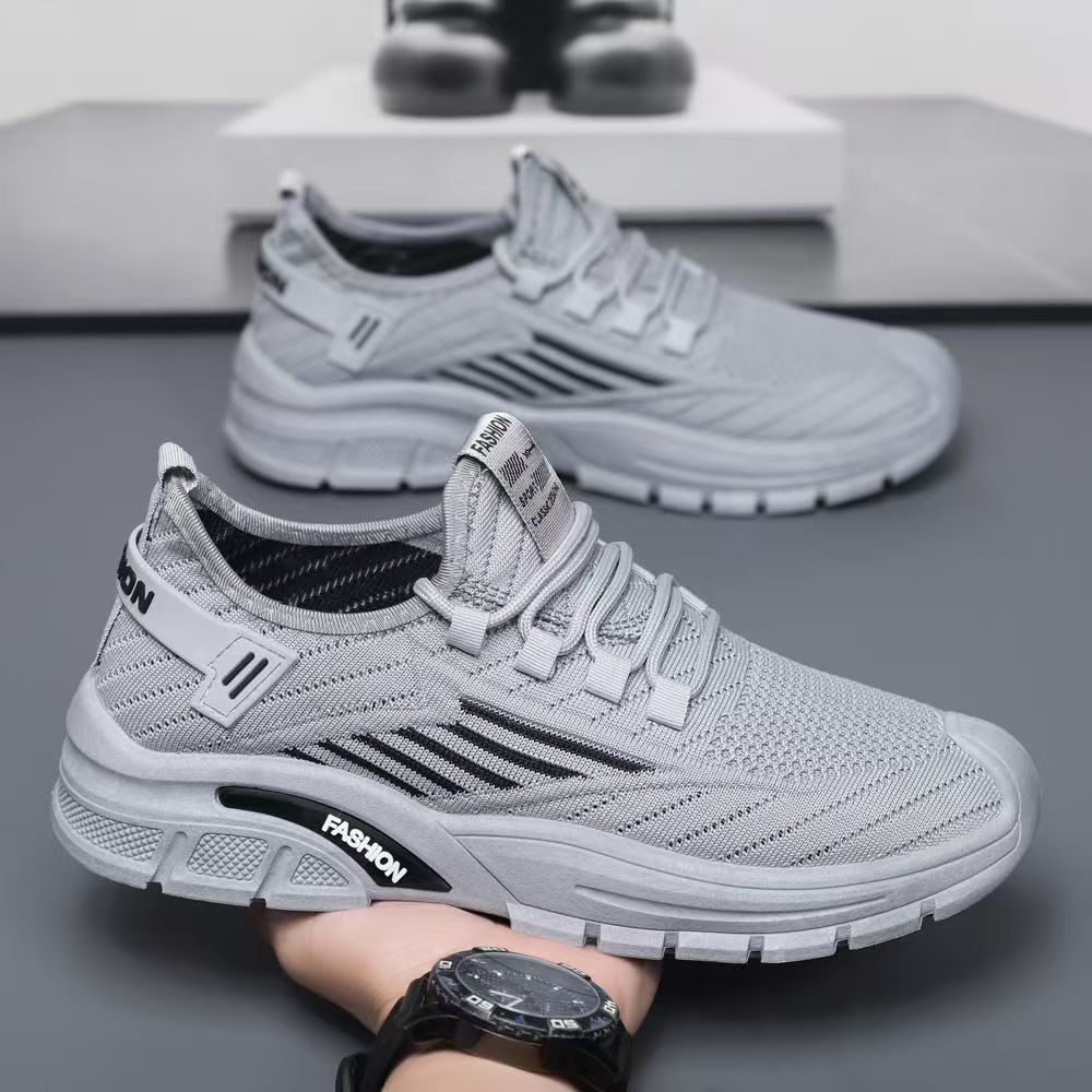 Zapatos de hombre de tejido volador de otoño simples y cómodos, zapatos casuales transpirables, suela gruesa aumentada, zapatos deportivos ligeros de bajo nivel de comercio exterior al por mayor